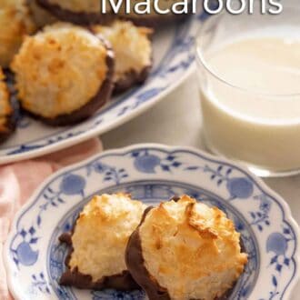 Pinterest graphic of a plate of two coconut macaroons by a cup of milk.