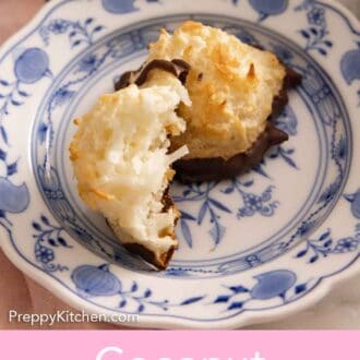 Pinterest graphic of two coconut macaroons, one with a bite taken out.
