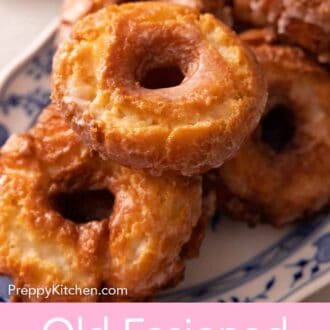 Pinterest graphic of a platter with a pile of old fashioned donuts.