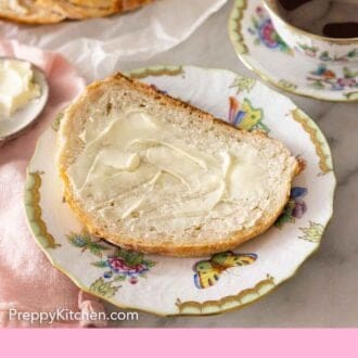 Pinterest graphic of a slice of artisan bread with butter spread over top.