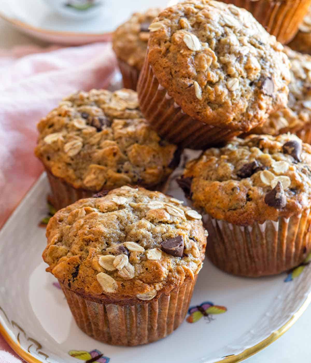 A plate with a pile of banana oatmeal muffins.