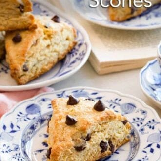 Pinterest graphic of a plate with a chocolate chip scone with more in the background.