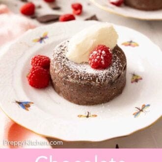 Pinterest graphic of a chocolate lava cake with ice cream, raspberries, and powdered sugar on top.