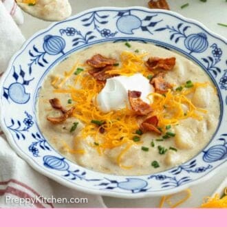 Pinterest graphic of a bowl of potato soup with a spoonful lifted.
