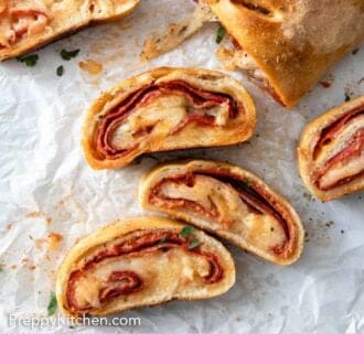 Pinterest graphic of an overhead view of cut stromboli on parchment.