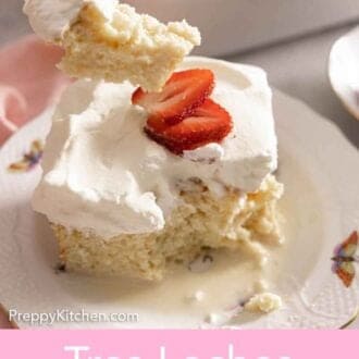 Pinterest graphic of a slice of tres leches cake with a forkful taken out.