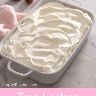 Pinterest graphic of a baking dish with a frosted tres leches cake.