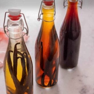 Pinterest graphic of three bottles homemade vanilla extract varying in darkness.