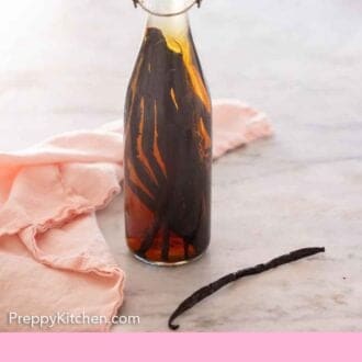 Pinterest graphic of a bottle of homemade vanilla extract with a bean on the side.