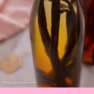 Pinterest graphic of a close up view of a bottle of homemade vanilla extract.