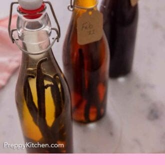 Pinterest graphic of three bottles of homemade vanilla extract with tags with dates on them.