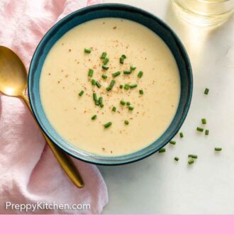 Pinterest graphic of an overhead view of a bowl of vichyssoise by a glass of wine.