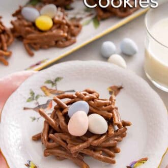Pinterest graphic of a plate with a birds nest cookie in front of a glass of milk and a platter of cookies.