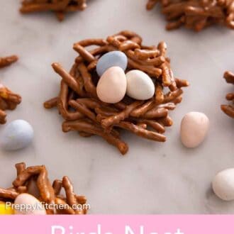 Pinterest graphic of multiple birds nest cookies with candy eggs around it.