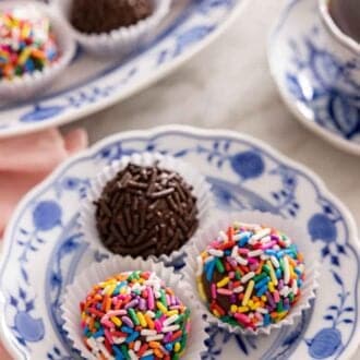 Pinterest graphic of a plate with three brigadeiros coated in sprinkles.