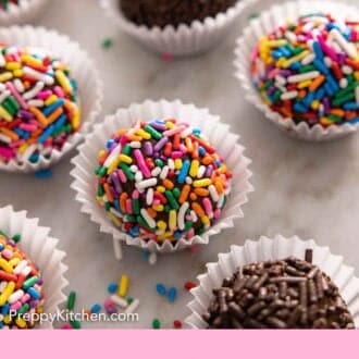 Pinterest graphic of multiple brigadeiros in mini cupcake liners with sprinkles scattered around.