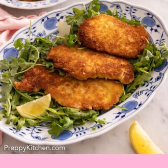 Pinterest graphic of a platter with three chicken Milanese cutlets over a bed of arugula.