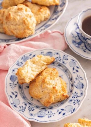 A plate with a drop biscuit with half of one, propped on top.