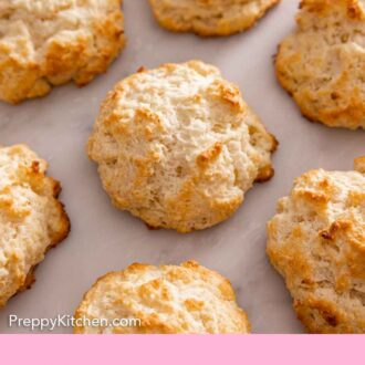 Pinterest graphic of multiple drop biscuits in a single layer.