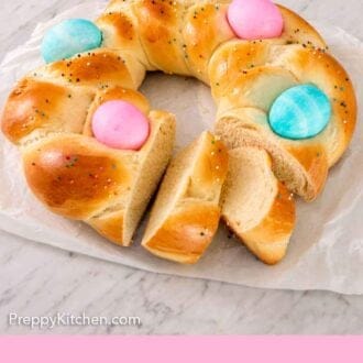 Pinterest graphic of an Easter bread with two pieces cut and slightly pulled out.