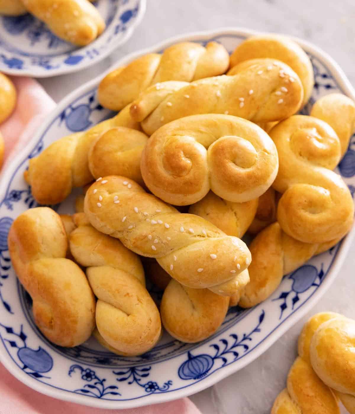 A platter of koulourakia in different twisted shapes.