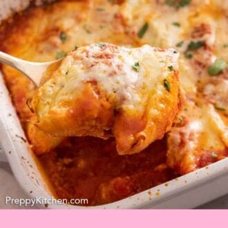Pinterest graphic of a spoonful of stuffed shells lifted from a baking dish.