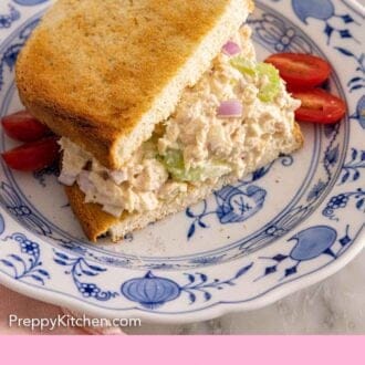 Pinterest graphic of tuna salad on sliced bread by halved cherry tomatoes.