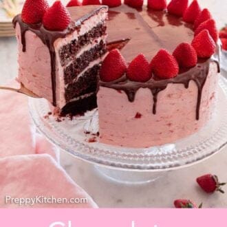 A chocolate strawberry cake with a slice being lifted out.