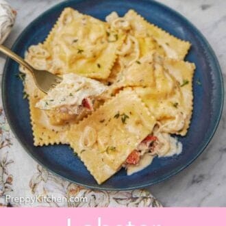 Pinterest graphic of a plate of lobster ravioli with a forkful lifted from the plate.