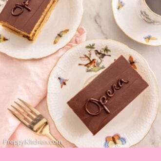 Pinterest graphic of an overhead view of two plates of opera cake and a cup of coffee on the side.