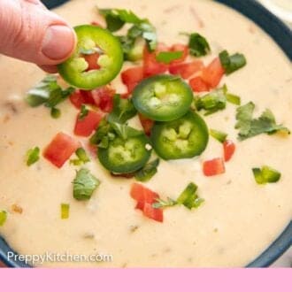 Pinterest graphic of sliced jalapeno added to a bowl of queso dip.