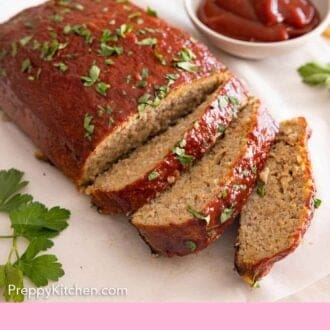 Pinterest graphic of a turkey meatloaf with three pieces sliced and a bowl of sauce in the background.