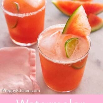 Pinterest graphic of two glasses of watermelon margaritas with lime and watermelon slices in the drinks.