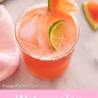 Pinterest graphic of a glass of watermelon margarita with lime and watermelon as garnish.
