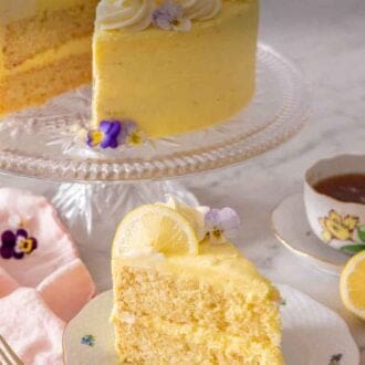 Pinterest graphic of a slice of lemon cake in front of a cake stand holding the rest of the cake.