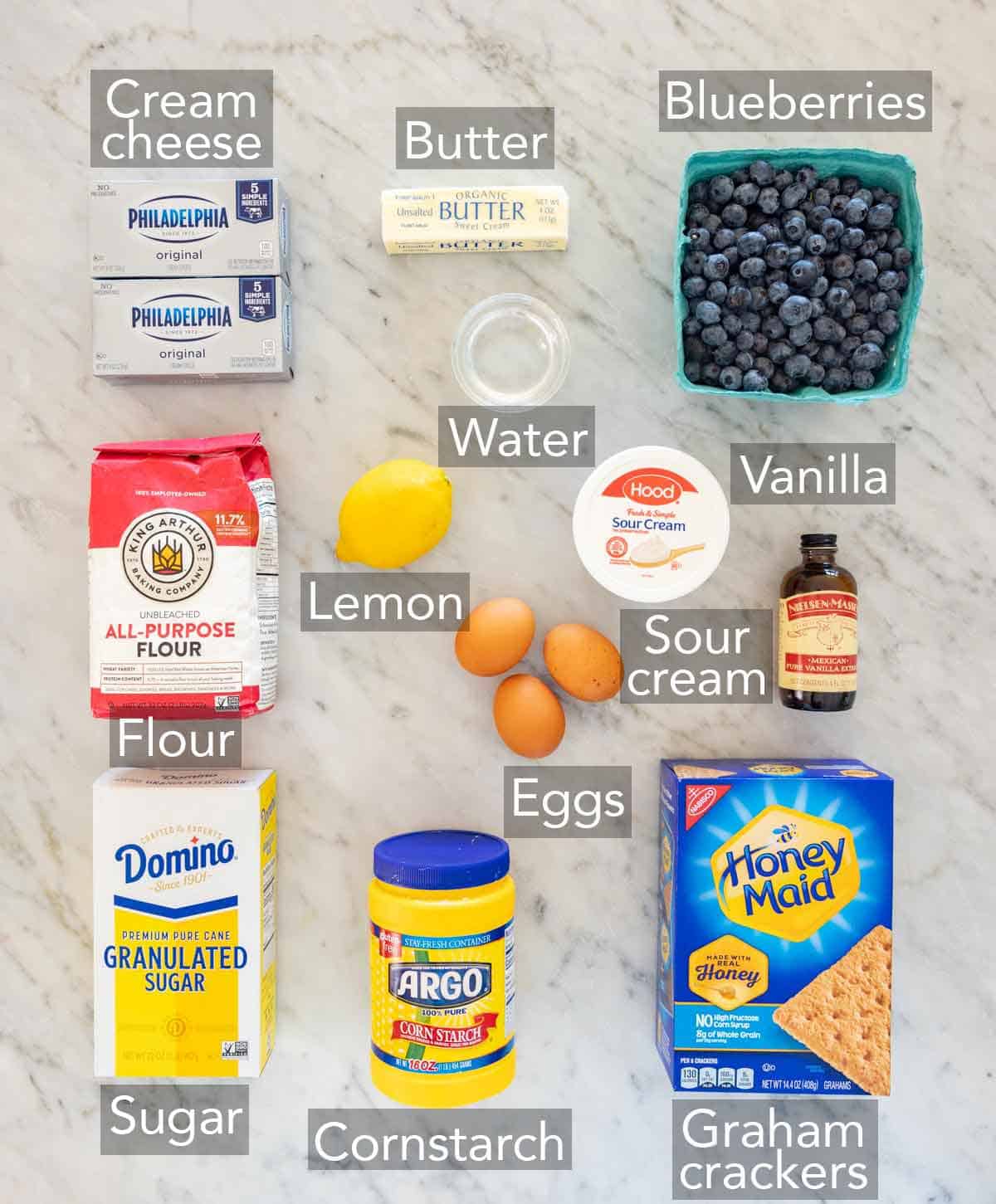 Ingredients needed to make a blueberry cheesecake.
