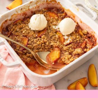 Pinterest graphic of a baking dish of peach crisp with two scoops of vanilla ice cream and a spoon on the crisp.