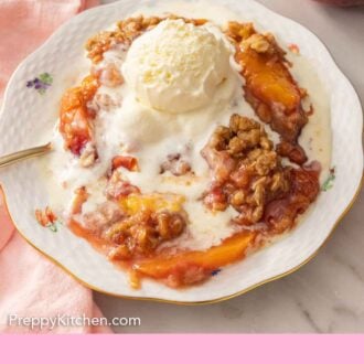 Pinterest graphic of a plate of peach crisp with a scoop of ice cream melting on top.