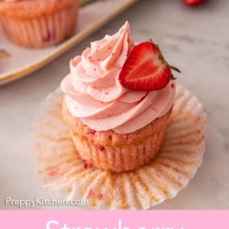 Pinterest graphic of a strawberry cupcake with the paper cupcake liner pulled down.