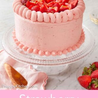 Pinterest graphic of a strawberry lemonade cake on a cake stand with fresh strawberries and lemon zest on top.