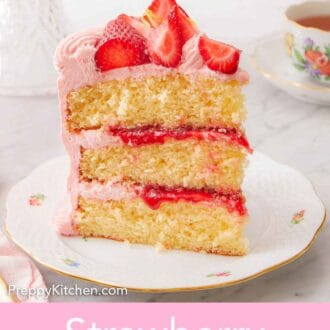 Pinterest graphic of a slice of strawberry lemonade cake on a plate, with fresh cut strawberries on top.