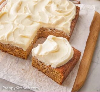 Pinterest graphic of a slice of banana cake pulled forward from the rest of the cake.