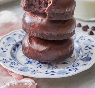 Pinterest graphic of three chocolate donuts stacked on top of each other, the top with a bite taken out.