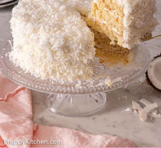 Pinterest graphic of a slice of coconut cake lifted from the cake.
