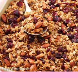 Pinterest graphic a sheet pan of granola with a spoonful on top.
