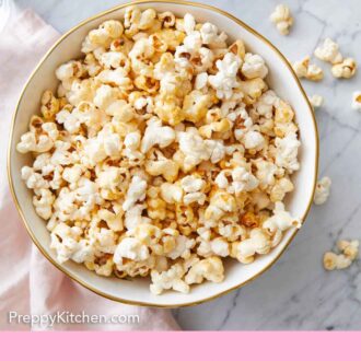 Pinterest graphic of an overhead view of a bowl of kettle corn with more scattered around on the counter.