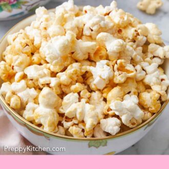 Pinterest graphic of kettle corn in a bowl with more scattered in the back.
