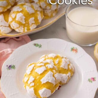 Pinterest graphic of a plate of two lemon crinkle cookies by a glass of milk.