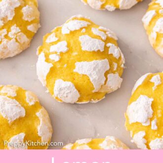 Pinterest graphic of multiple lemon crinkle cookies on a marble surface.