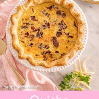 Pinterest graphic of an overhead view of a quiche Lorraine with garnishes and forks on the side.
